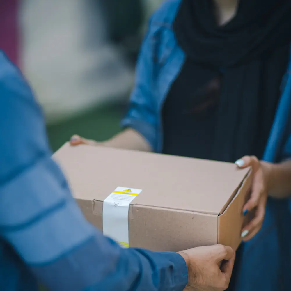 A person receiving a delivered box