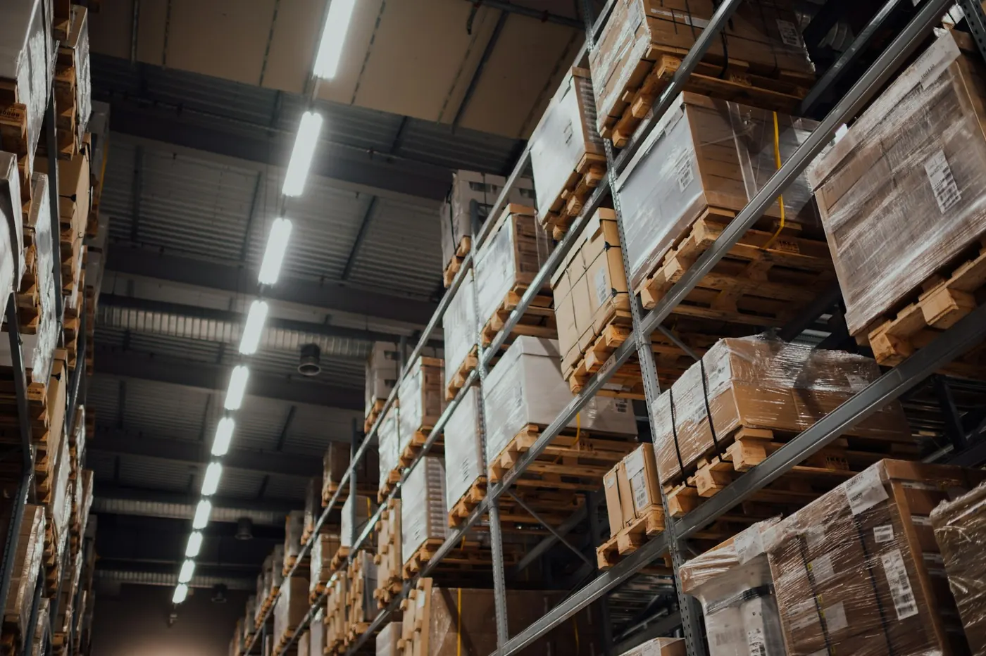 Pallet racking stacked with cases inside a grocery distribution center